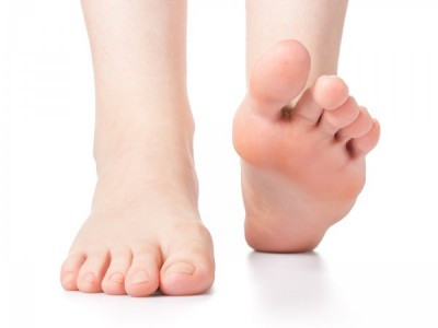 Woman foot on white background isolated close-up